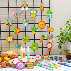 Colorful magnetic toys on a grid wall with markers and paint supplies on a table.