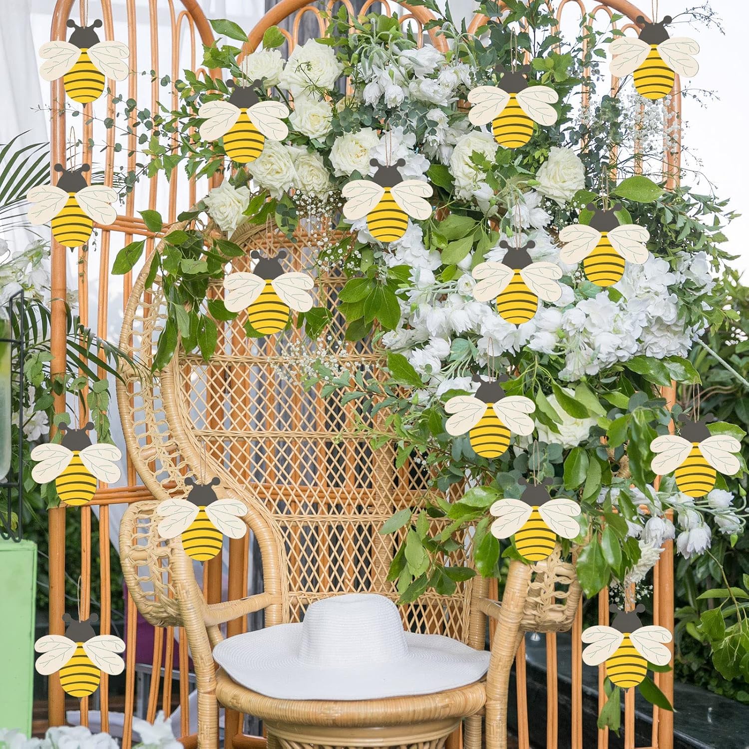 Decorative chair with floral arrangement and bee-shaped decorations