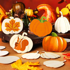 Decorative pumpkins and leaf items on a wooden surface with a warm background.