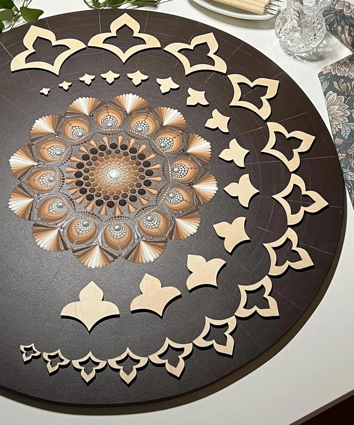 Decorative table mat with intricate patterns on a round table