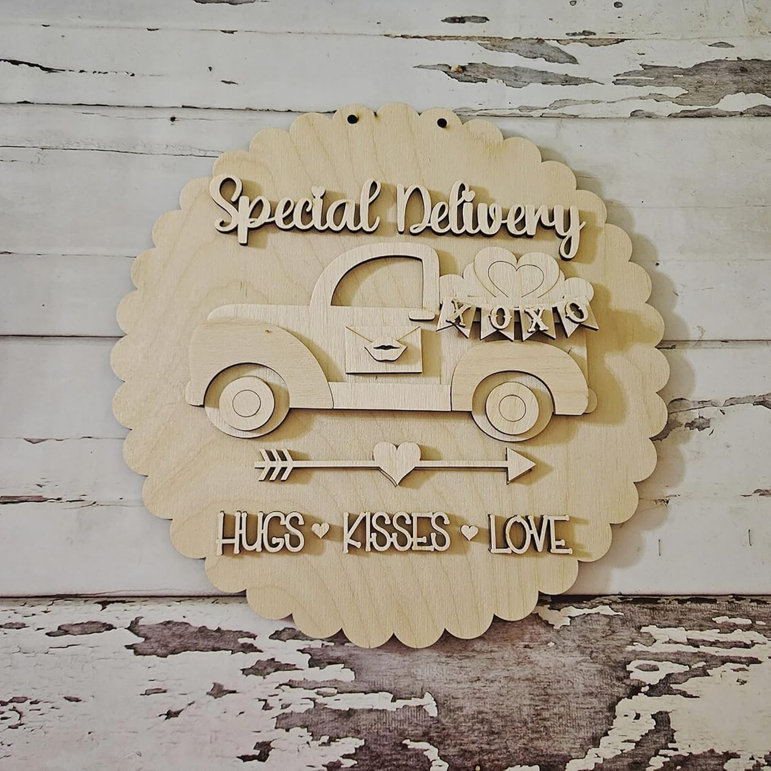 Wooden wall decor with 'Special Delivery' text and car illustration on a rustic wooden background