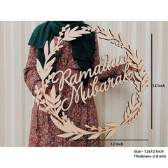 Wooden wreath with 'Ramadan Mubarak' text and measurements on a plain background