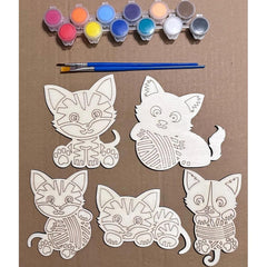 Coloring kit with cat designs and paint bottles on a brown background