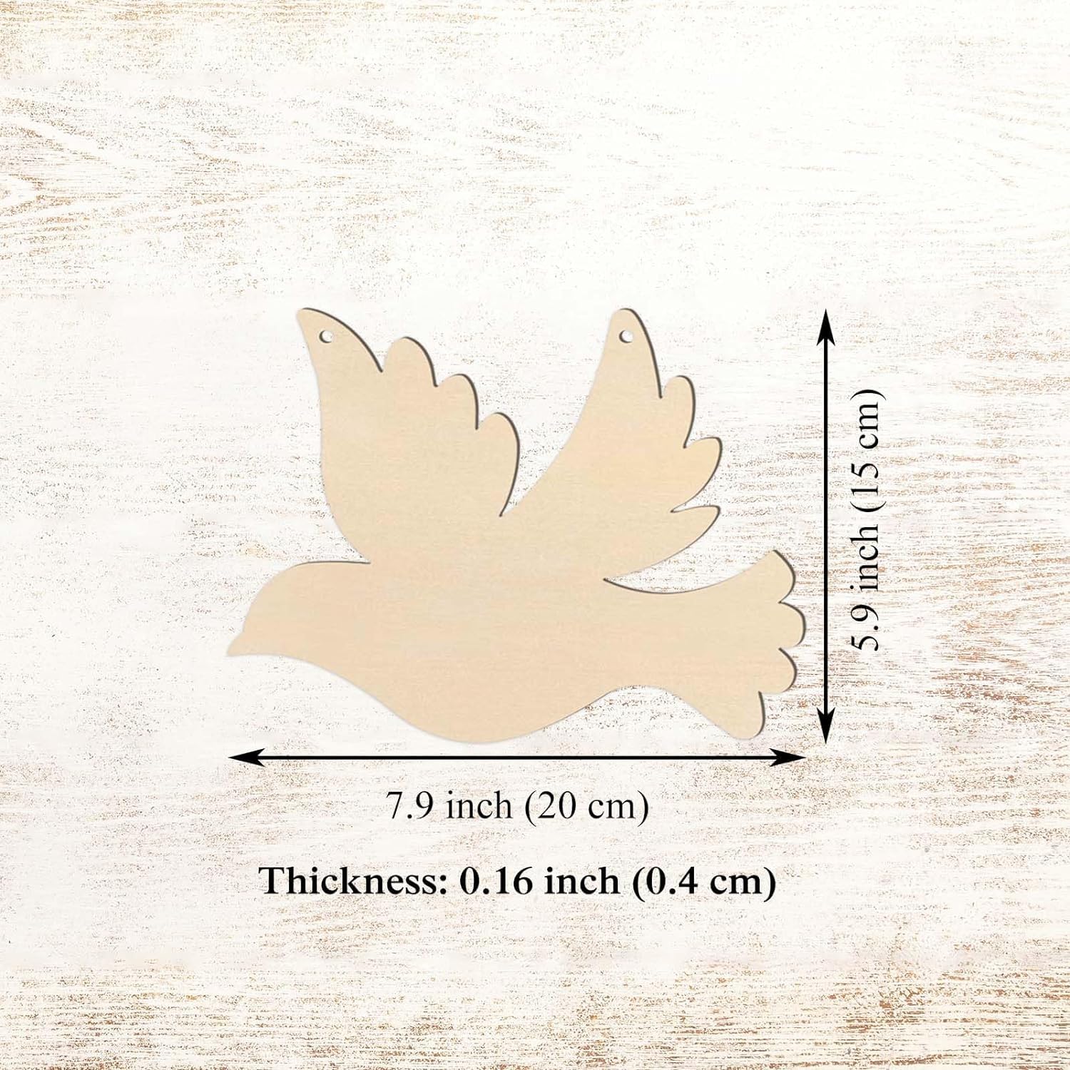Wooden dove shape with measurements on a light wood background