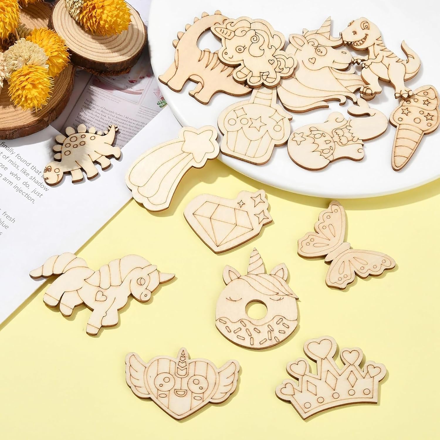 Wooden cutouts of various shapes and designs on a yellow surface.