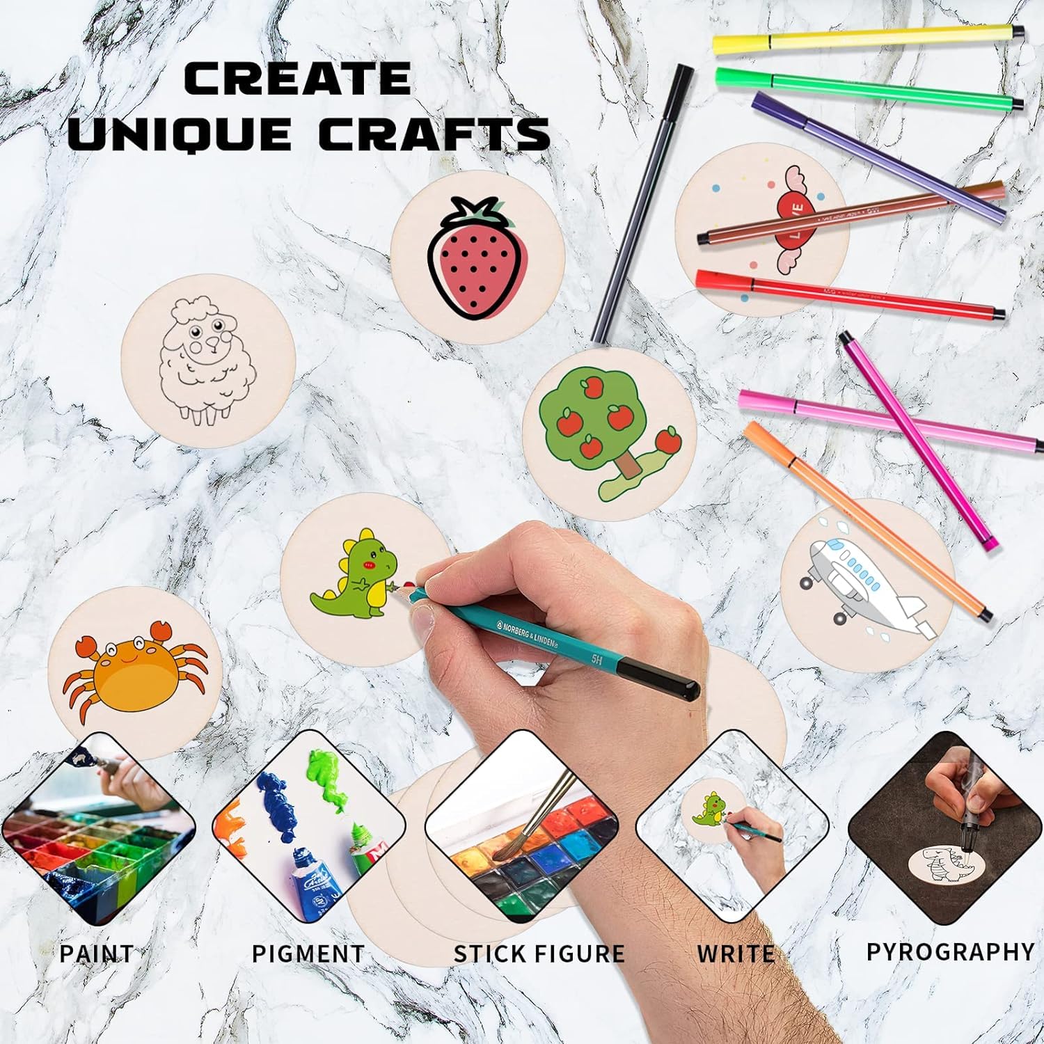 Wooden discs with pre-drawn designs, markers, and a hand painting on a marble surface.