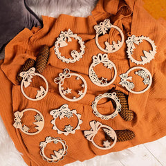 Wooden decorative wreaths on an orange fabric background