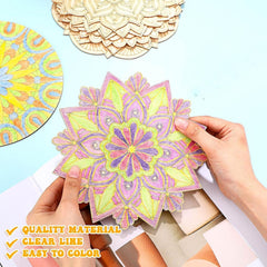 Colorful mandala design being held by hands with other mandalas in the background.