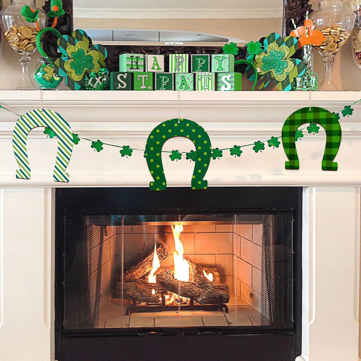Decorated fireplace mantel with St. Patrick's Day decorations including shamrocks, horseshoes, and 'Happy St. Pat's' sign.