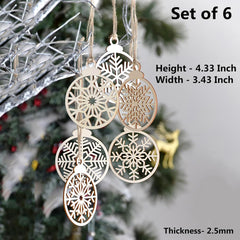 Set of six decorative snowflake ornaments on a Christmas tree with measurements displayed.