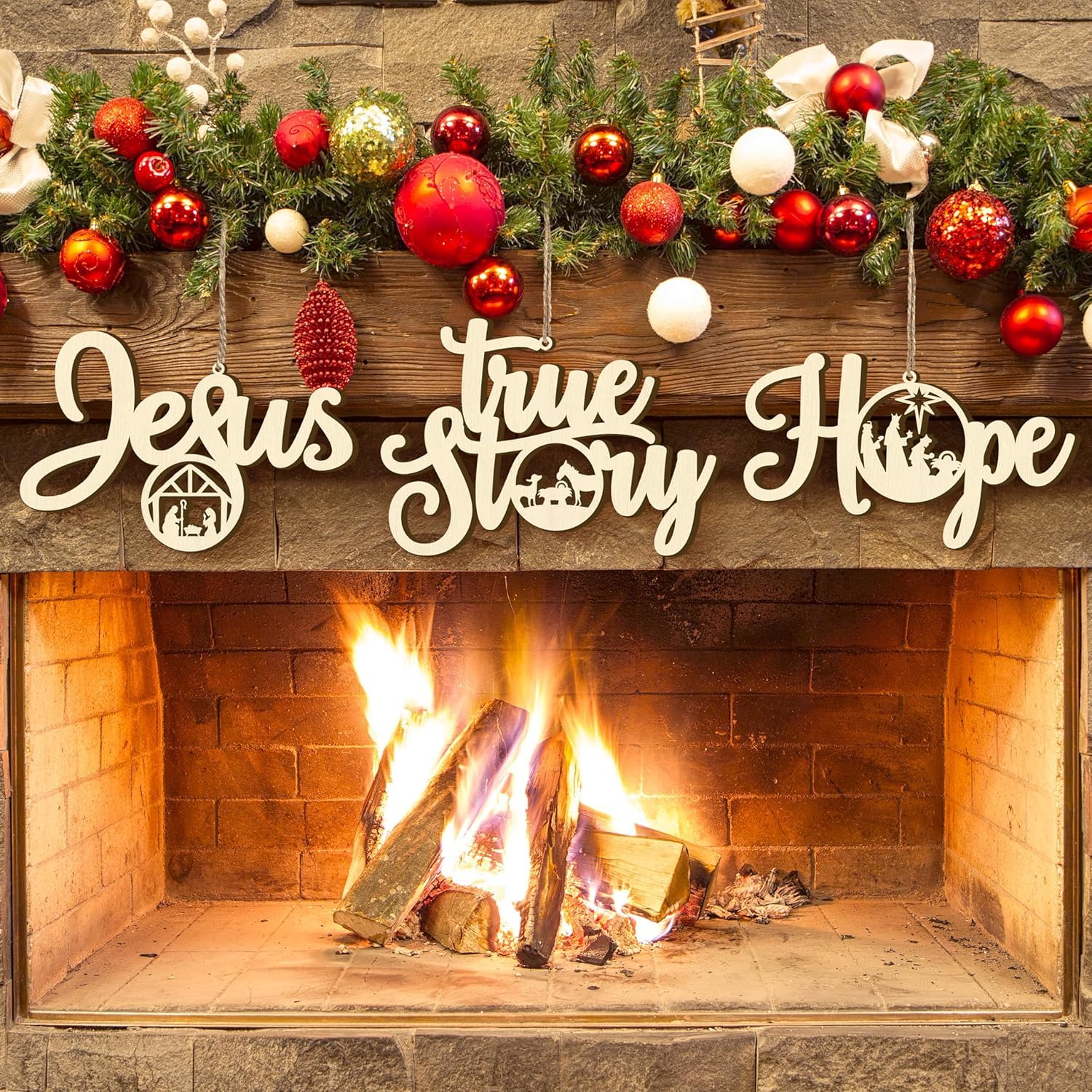 Decorative Christmas mantel with ornaments and 'Jesus True Story Hope' sign over a fireplace.