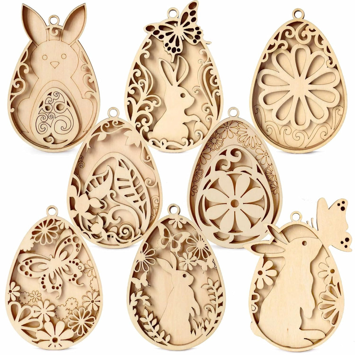 Set of decorative wooden Easter egg molds with rabbit and floral designs on a white background.