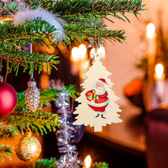 Decorative Christmas ornament of a Santa Claus tree hanging on a lit Christmas tree with warm background.