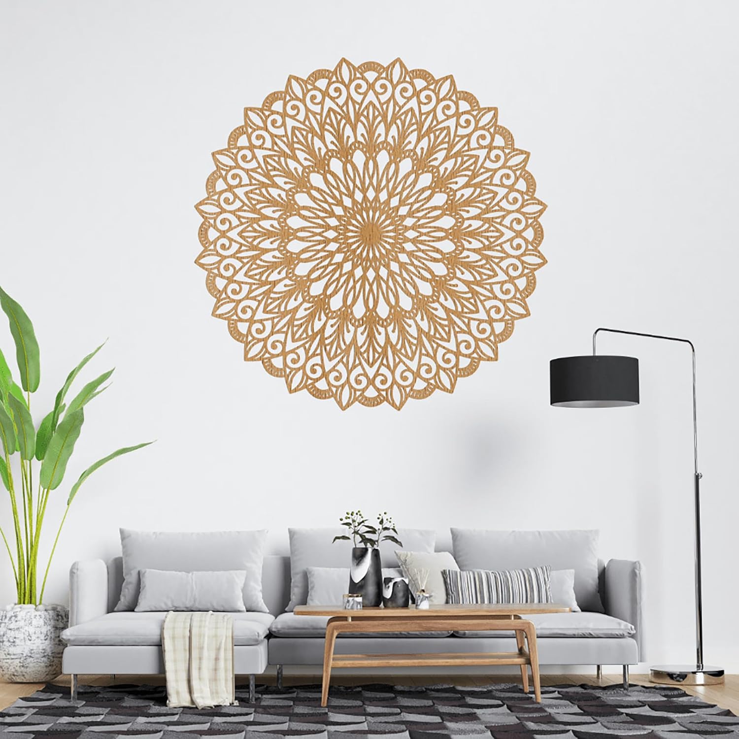 Decorative wall mandala in a living room setting with a sofa, coffee table, and lamp.