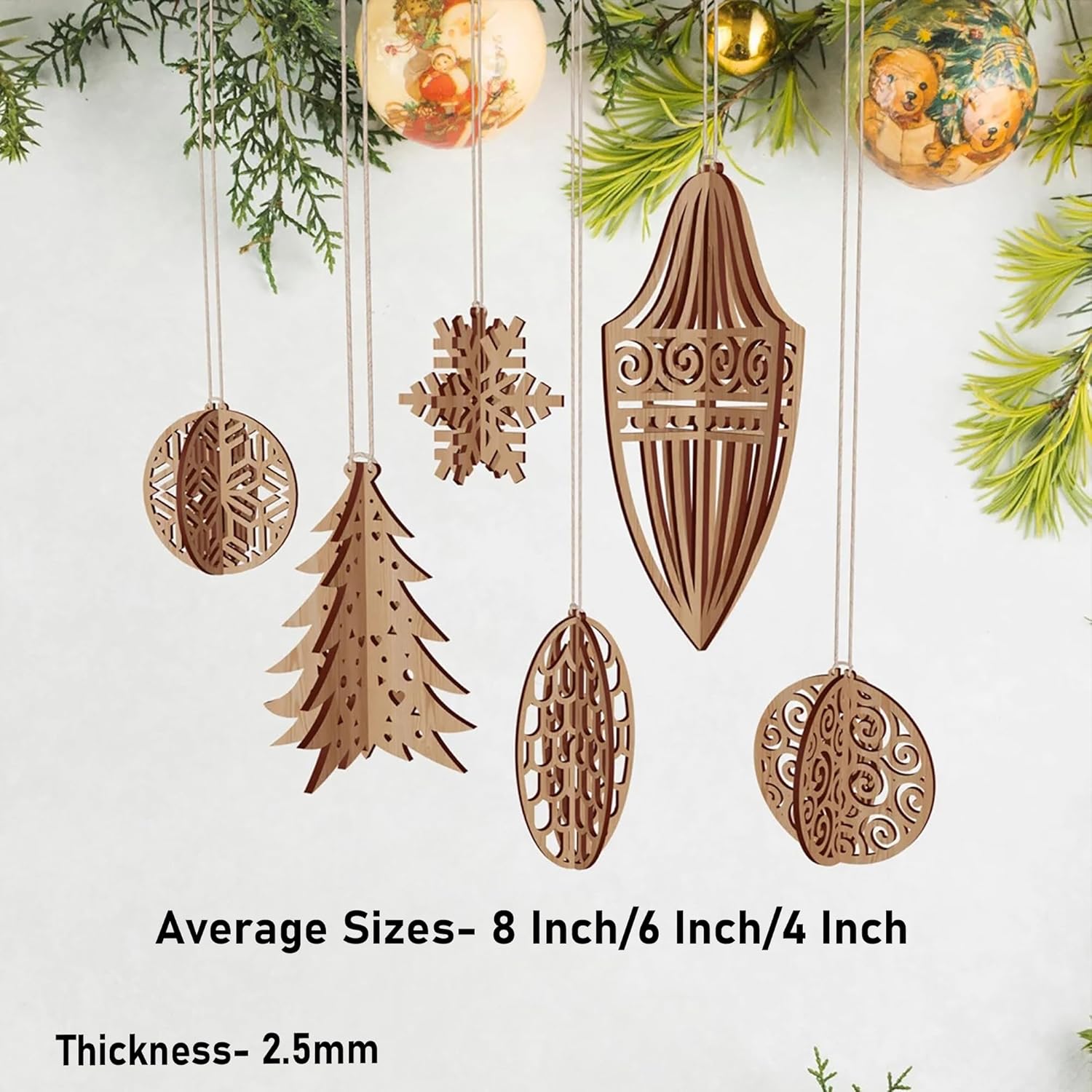 Set of wooden Christmas ornaments with various patterns hanging against a white background.