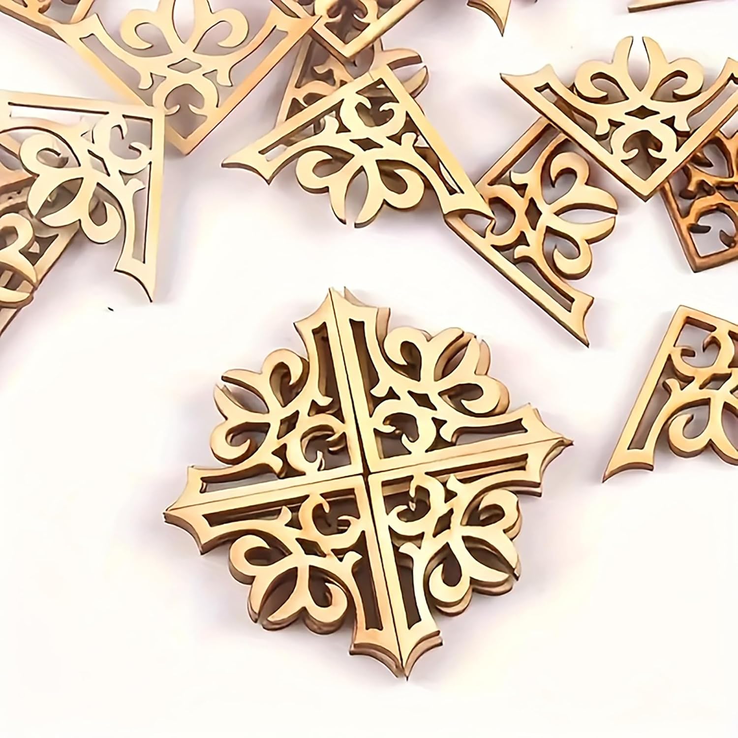Decorative gold crosses on a white background