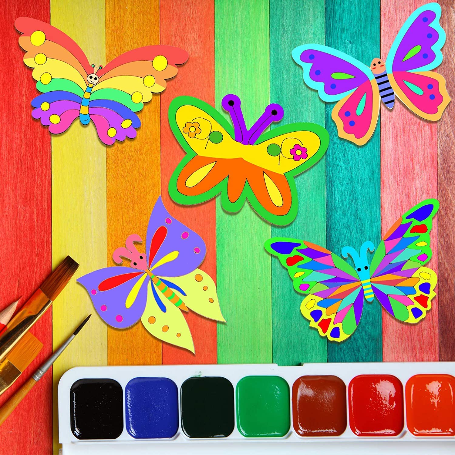 Colorful butterfly crafts on a striped background with a paint palette.
