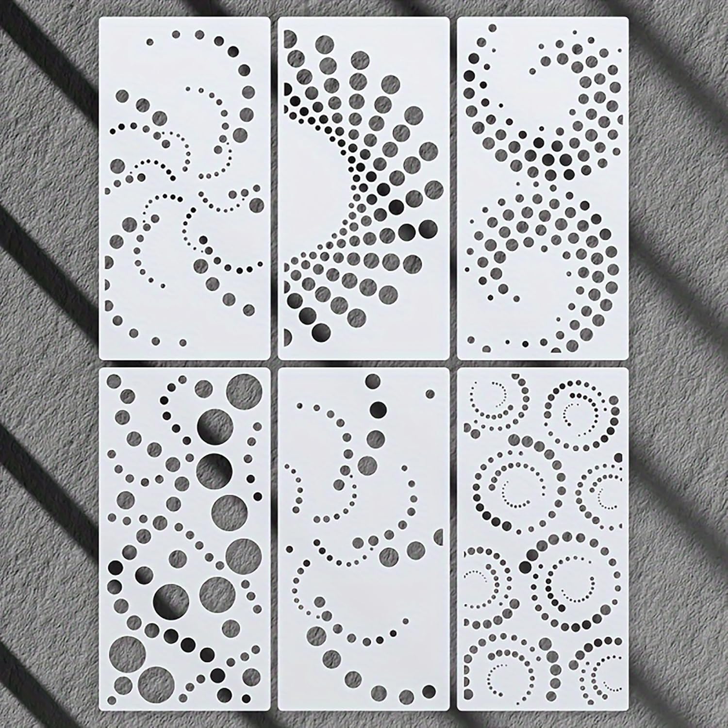 Six decorative panels with geometric patterns on a gray surface