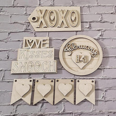 Decorative wooden signs with phrases and hearts on a brick wall background