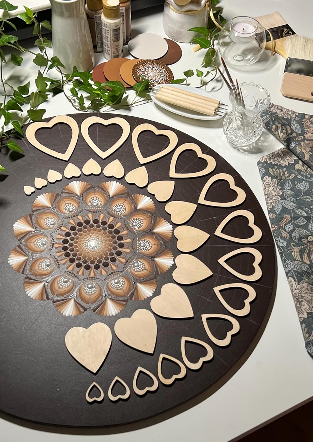 Decorative round mat with heart patterns on a table setting.