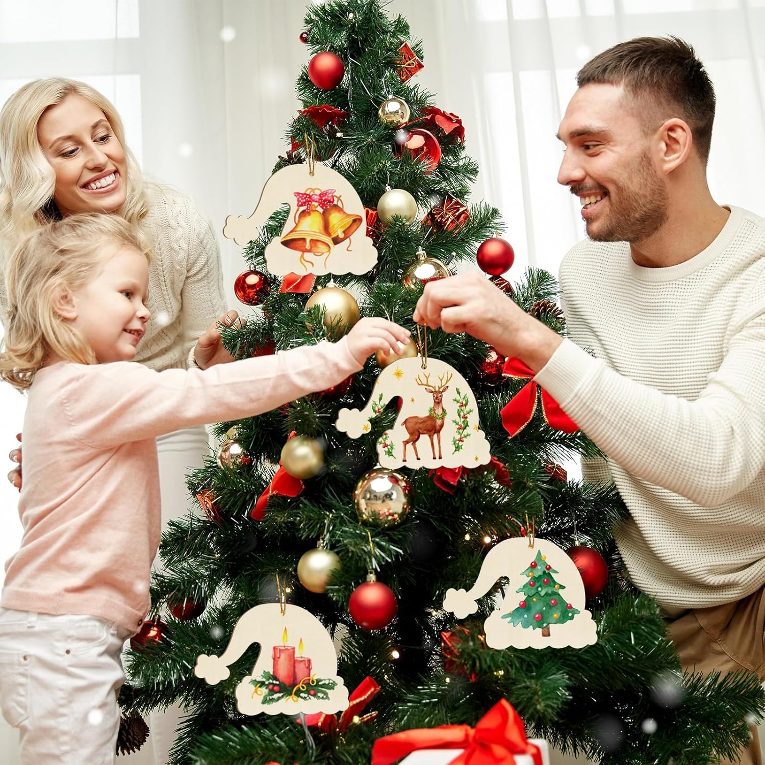 Family decorating a Christmas tree with ornaments
