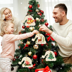 Family decorating a Christmas tree with ornaments