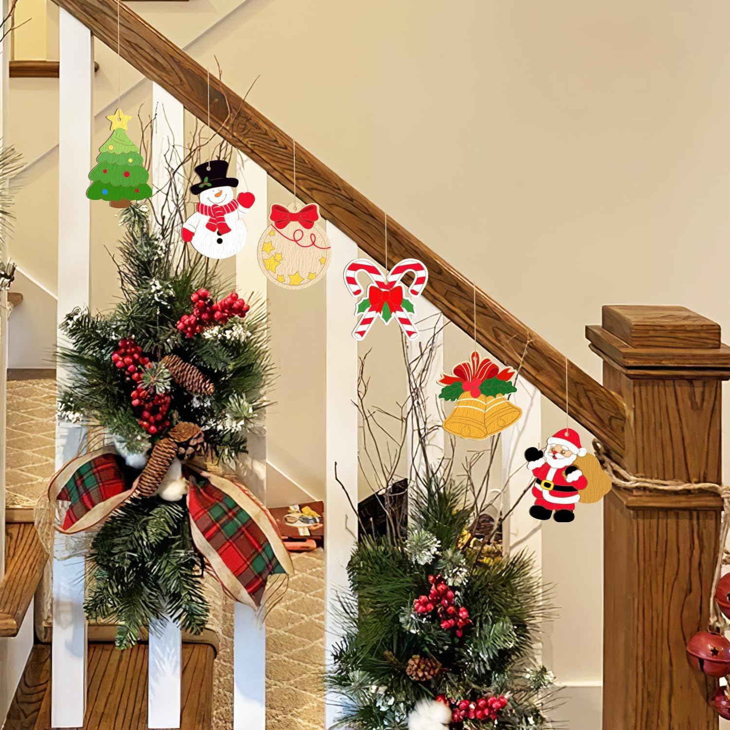 Decorative Christmas ornaments hanging on a staircase banister.