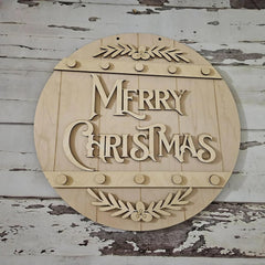 Wooden 'Merry Christmas' sign with leaf designs on a rustic wooden background