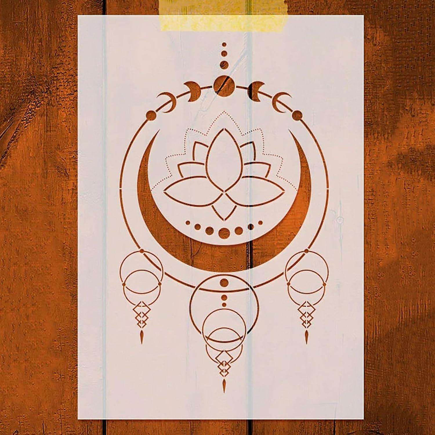 Decorative paper with a lotus flower design on a wooden surface