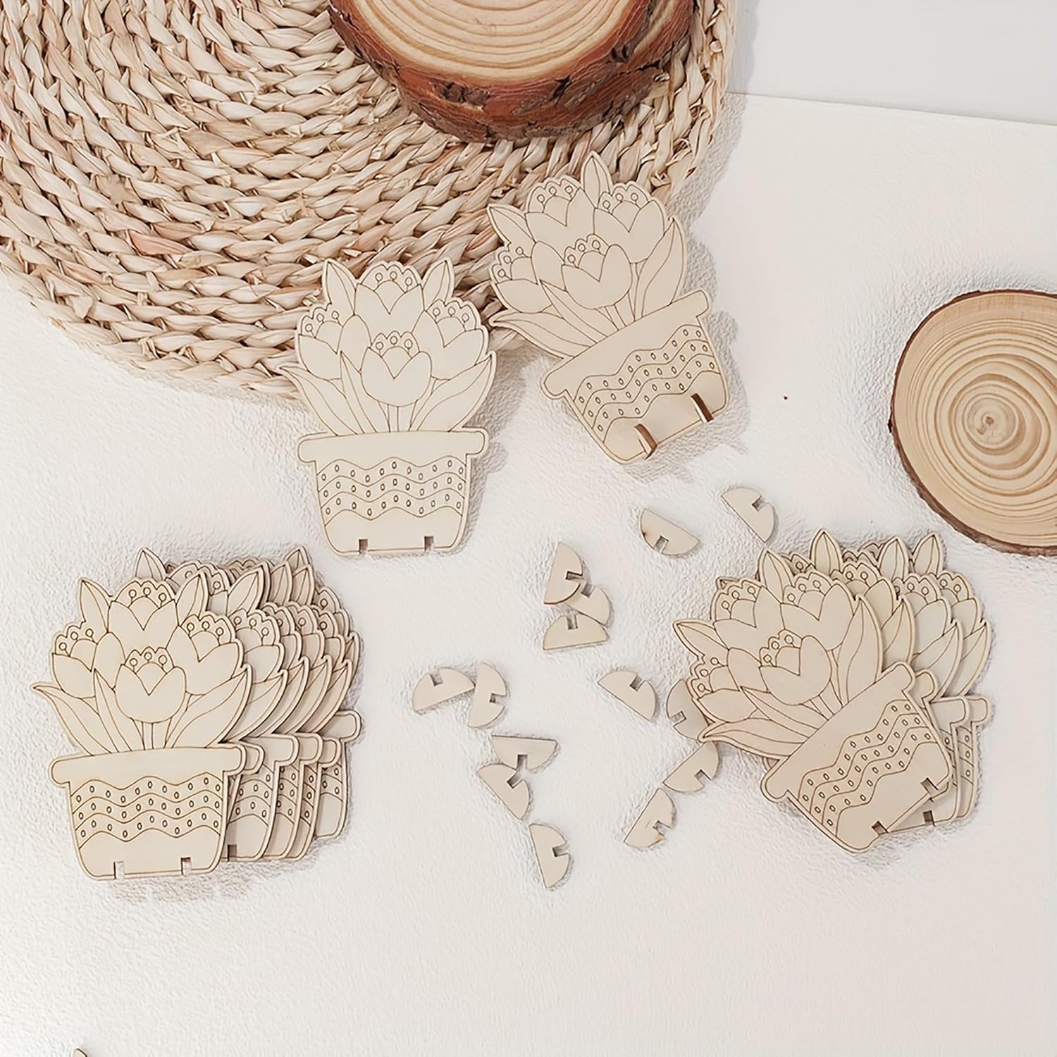 Wooden succulent plant cutouts on a white surface with natural wood elements.