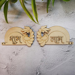 Two wooden phonetic toys with Hindi script on a textured wall.