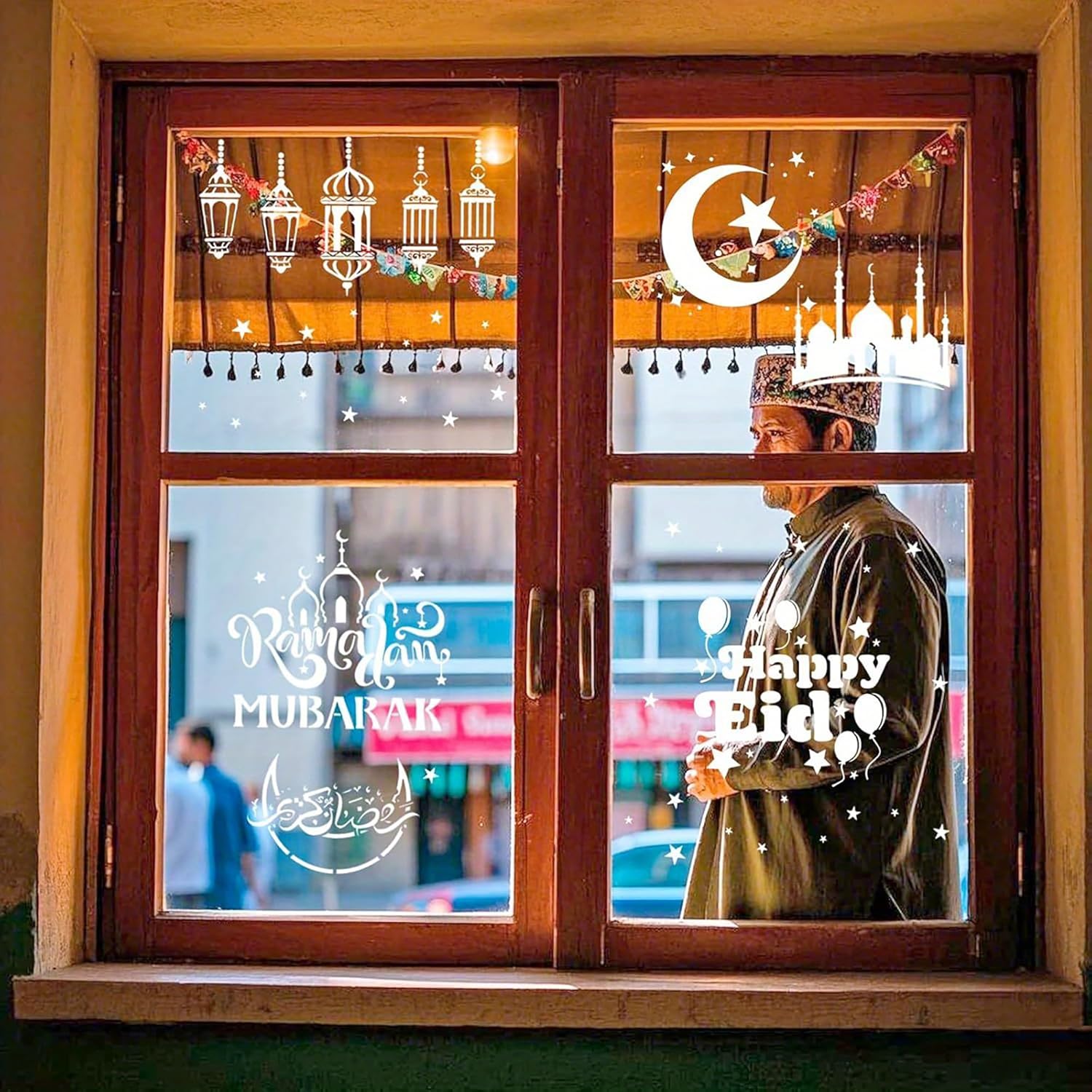 Decorative window with 'Happy Eid' and 'Mubarak' text, showing a person wearing a traditional headscarf.