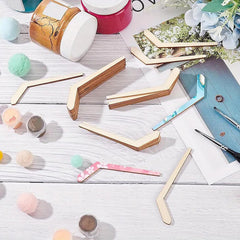 Wooden photo frames on a light wooden surface with decorative items.