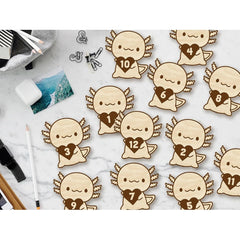 Wooden angel figures with heart numbers on a marble surface