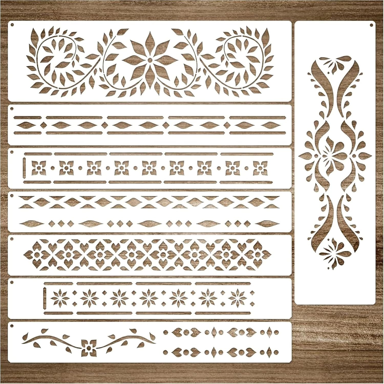 Set of decorative stencils with various patterns on a wooden surface