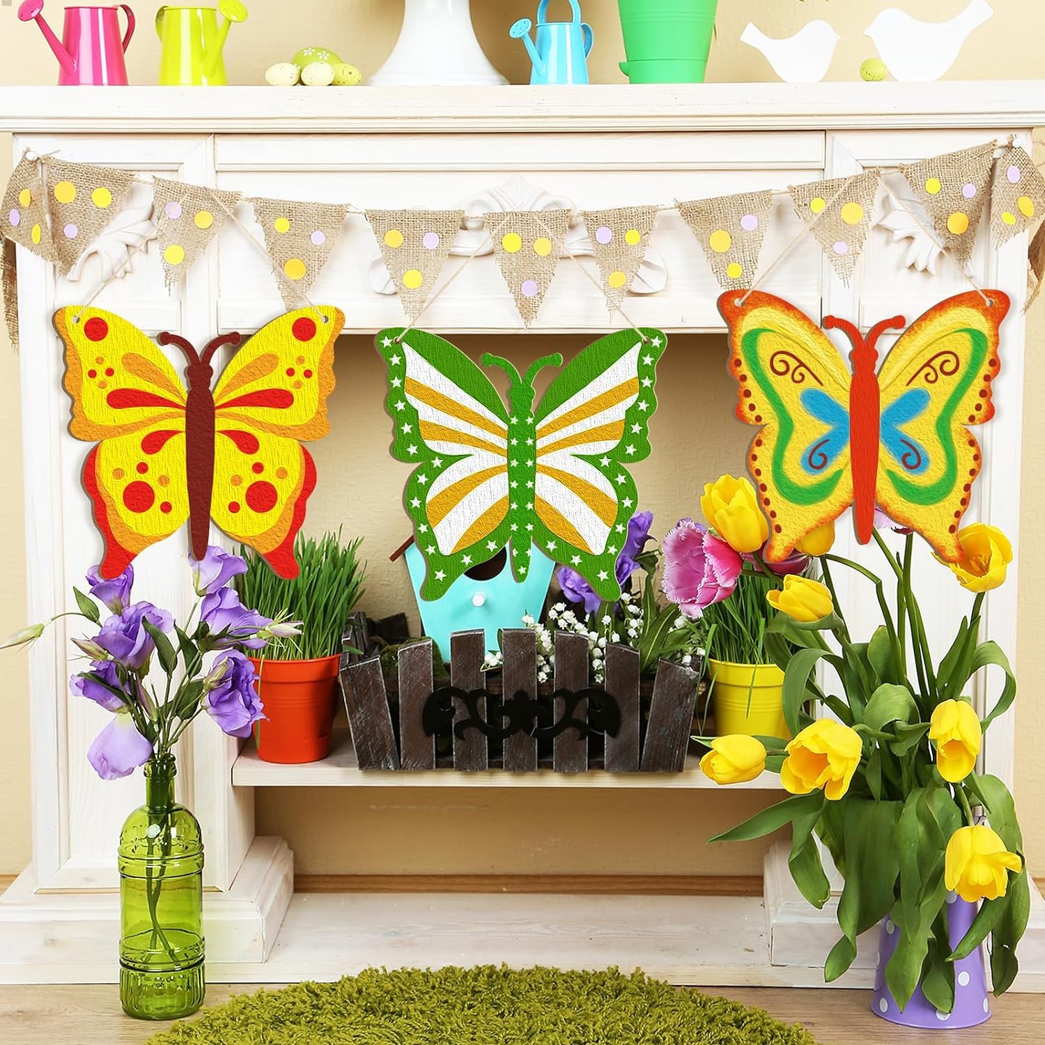 Decorative butterflies and flowers on a shelf with a colorful banner above.