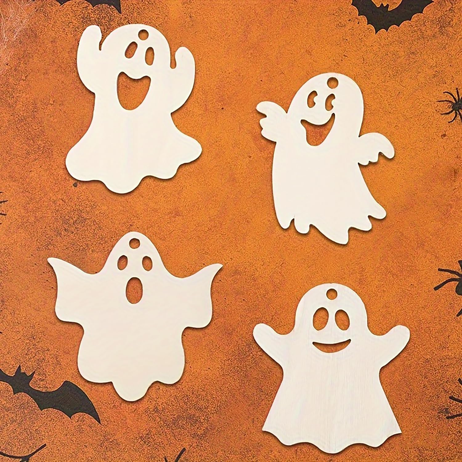 White ghost cutouts on an orange Halloween-themed background with spiders and bats.