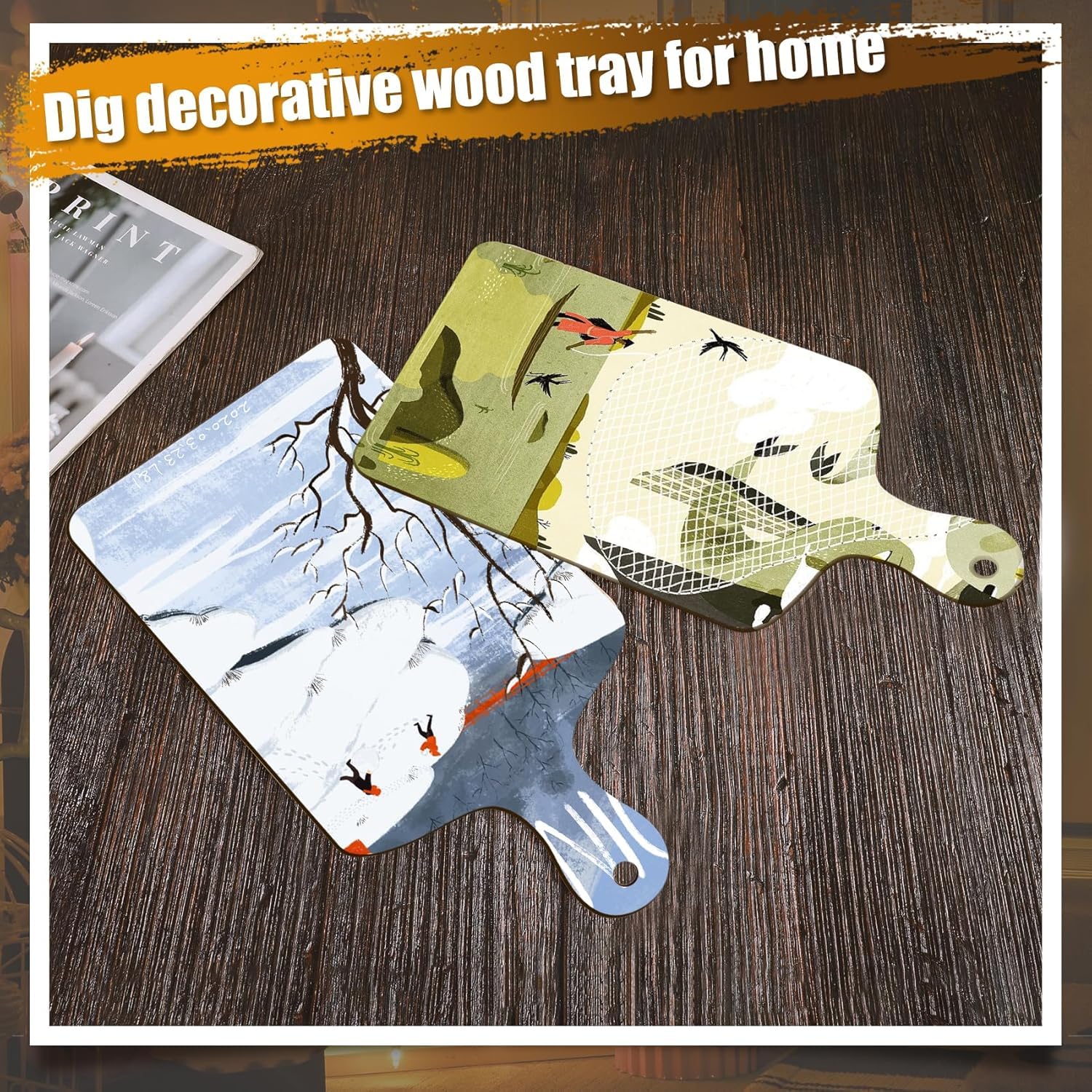 Decorative wood trays with nature-themed designs on a wooden surface.