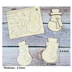 Wooden snowman ornament kit with pieces and an unassembled ornament on a wooden surface.