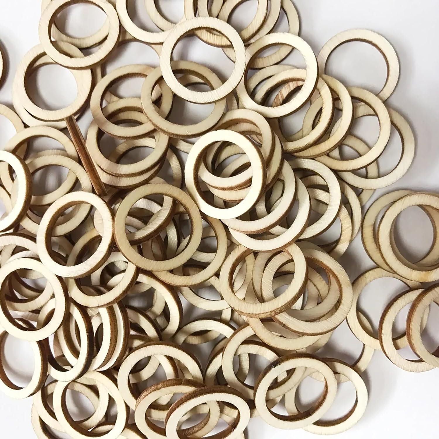 Pile of wooden rings on a white background