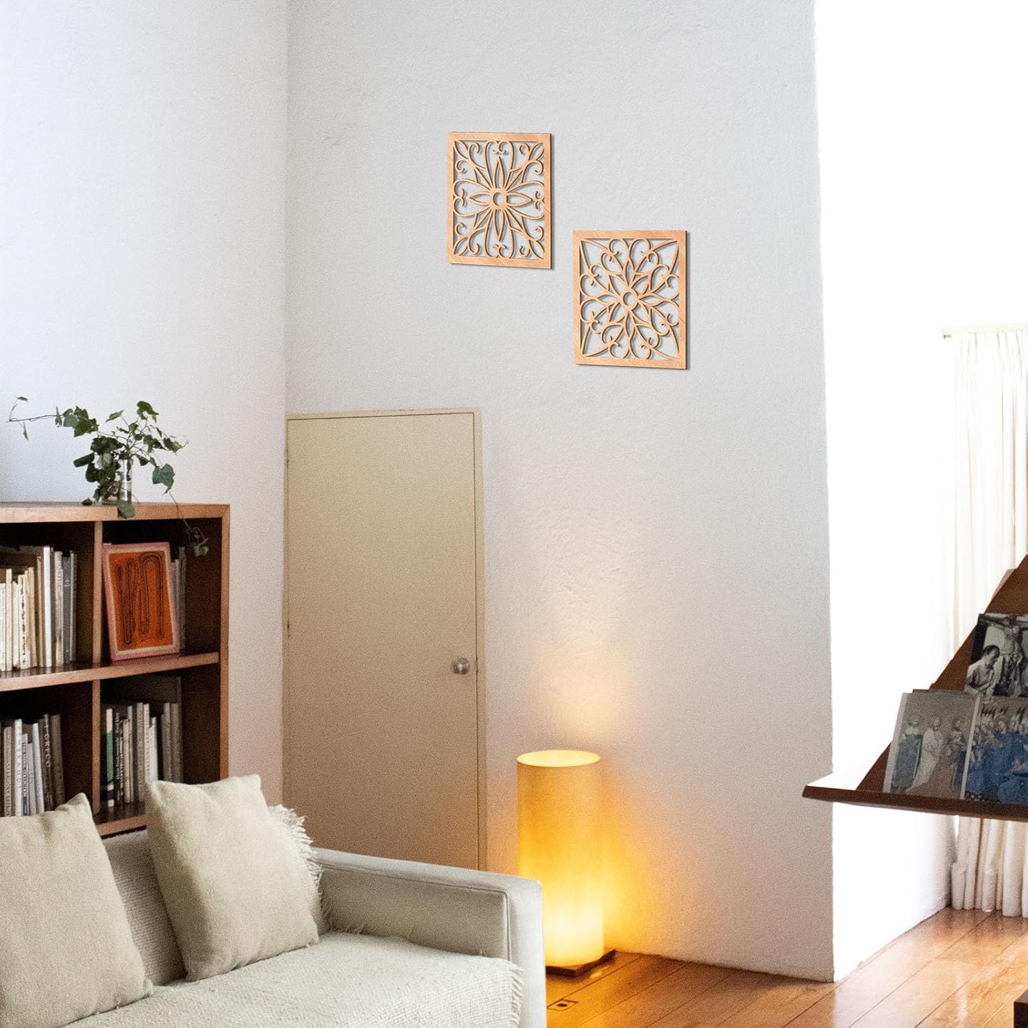 Living room with a sofa, bookshelf, and decorative wall art