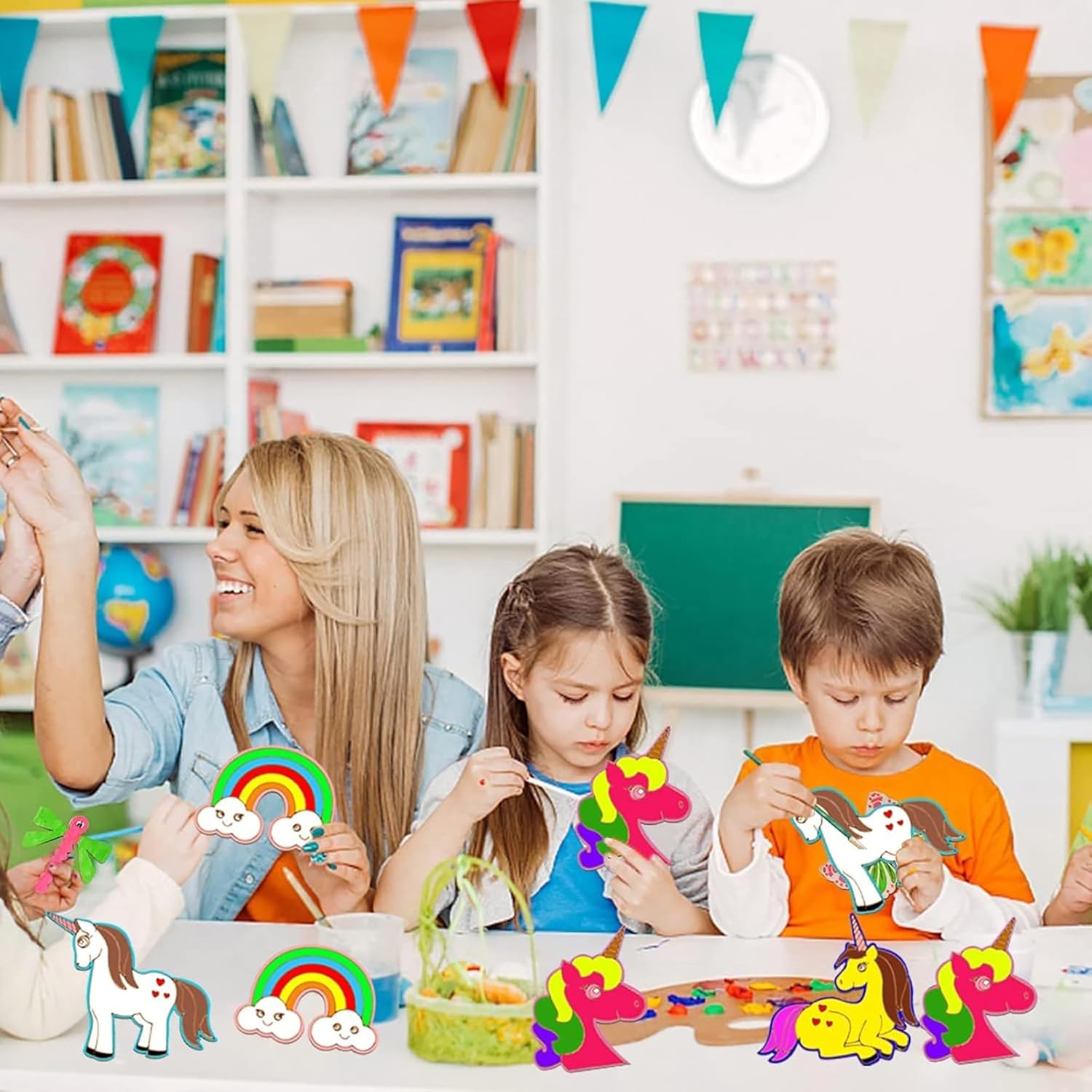 Children and a teacher engaged in craft activities with colorful paper unicorns and rainbows in a classroom setting.