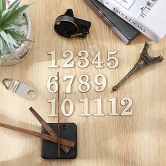 Wooden numbers on a wooden surface with a plant and book in the background