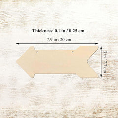 Wooden arrow-shaped cutout with measurements on a wooden surface