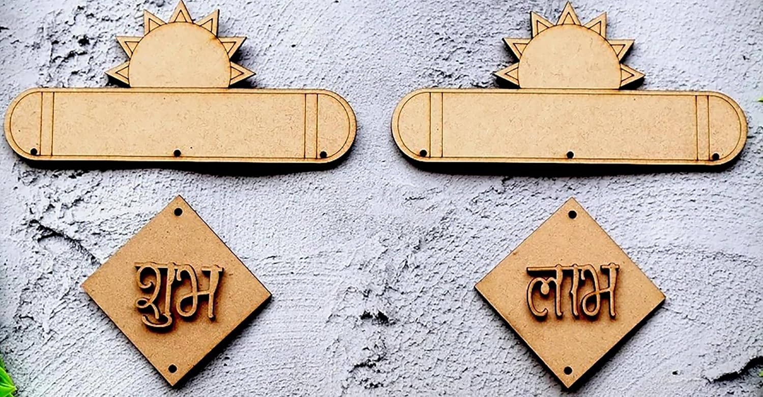 Decorative wooden signs with sun designs and engraved text on a textured surface