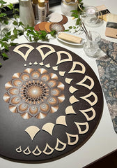 Decorative round mat with geometric design on a table with candles and plants