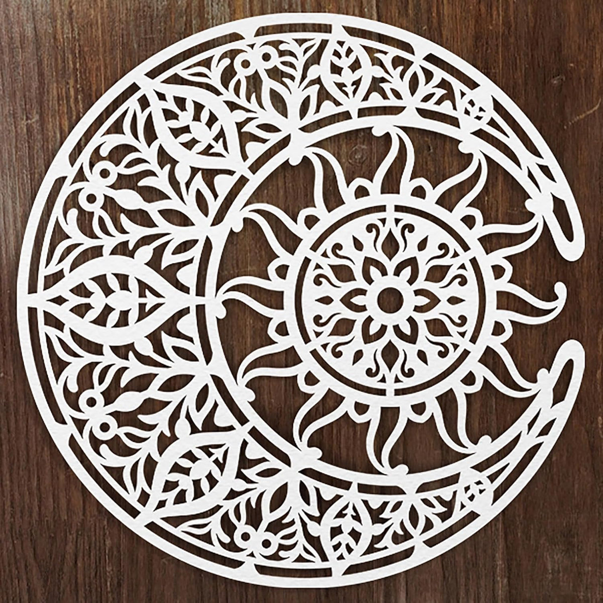 Decorative white cutout with intricate patterns on a wooden background