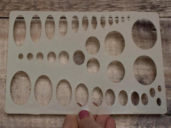 Wooden pegboard with holes on a wooden surface