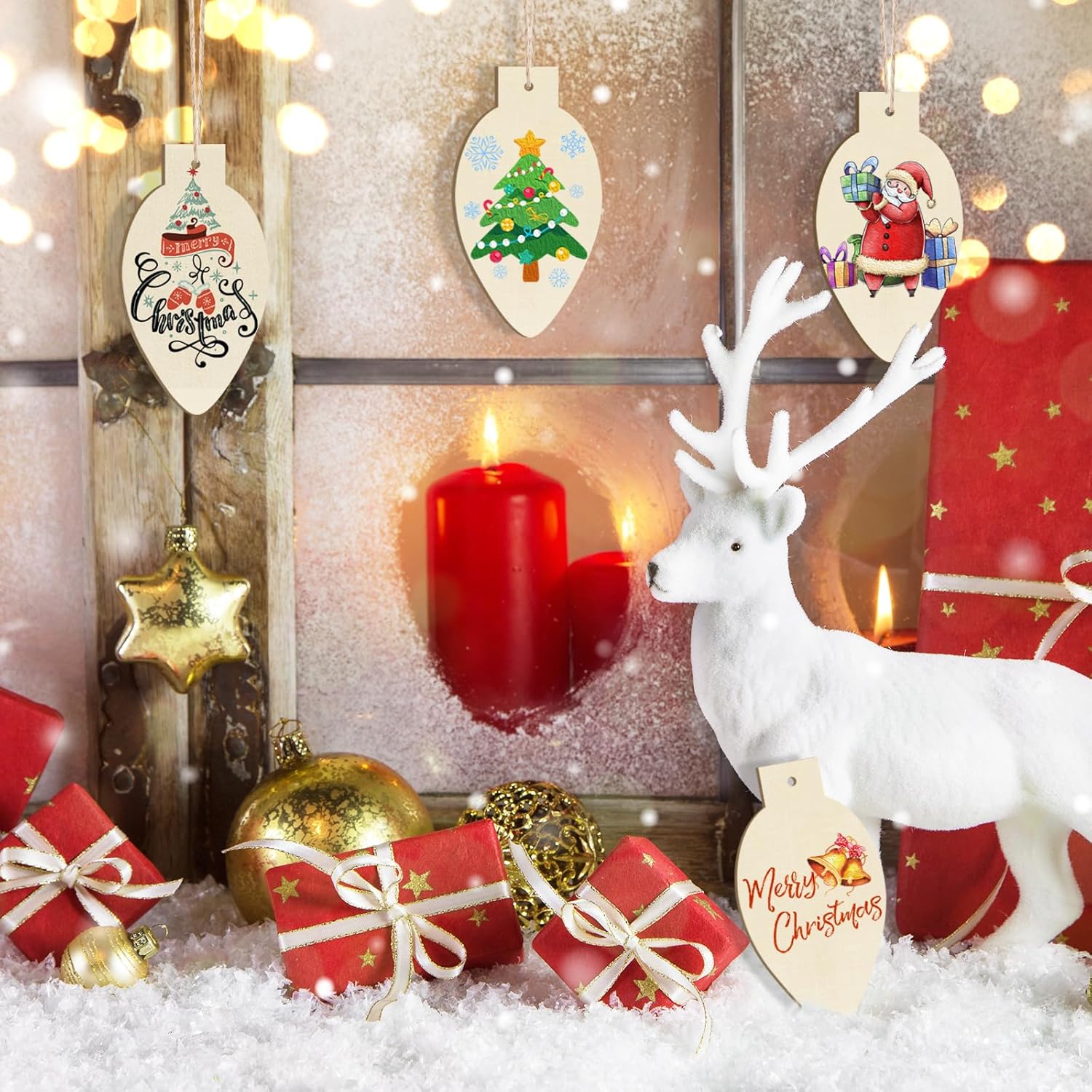 Decorative Christmas scene with reindeer, candles, and ornaments on a snowy background.