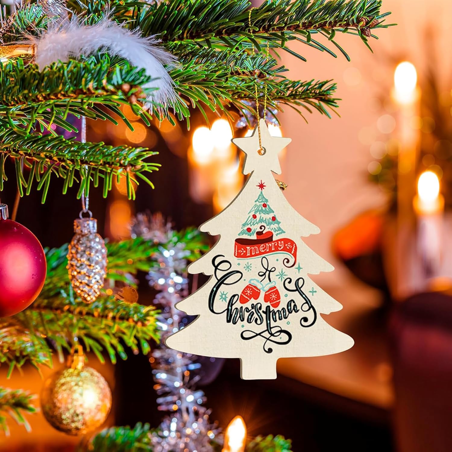 Decorative Christmas tree ornament with 'Merry Christmas' text on a lit candle background.